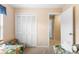 Cozy bedroom with twin beds, closet, and neutral tones for a relaxing atmosphere at 7760 Indian Ridge N Trl, Kissimmee, FL 34747
