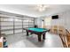 Bright game room featuring a pool table, seating, and ample space at 7760 Indian Ridge N Trl, Kissimmee, FL 34747