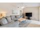 Bright and open living room featuring comfortable seating and a flat screen TV at 7760 Indian Ridge N Trl, Kissimmee, FL 34747