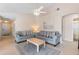 Cozy living room featuring sofas, a coffee table, and neutral decor for relaxation at 7760 Indian Ridge N Trl, Kissimmee, FL 34747