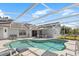 Inviting screened-in pool area with comfortable seating, perfect for relaxation and outdoor entertainment at 7760 Indian Ridge N Trl, Kissimmee, FL 34747