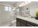 Clean bathroom with granite countertop vanity, glass-enclosed shower, and tile surround at 8522 Blue Horizon Ct, Kissimmee, FL 34747
