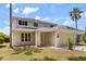 Attractive two-story home featuring manicured landscaping and a two-car garage at 8522 Blue Horizon Ct, Kissimmee, FL 34747