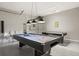 Pool table is the centerpiece of this converted and remodeled garage game room at 8522 Blue Horizon Ct, Kissimmee, FL 34747