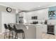Well-equipped kitchen with granite counters, stainless steel appliances, and a cozy breakfast bar at 8522 Blue Horizon Ct, Kissimmee, FL 34747