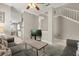 View of the living room with carpeted floor, comfortable sofas, and stairway to the upper level at 8522 Blue Horizon Ct, Kissimmee, FL 34747