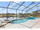 Screened-in pool, jacuzzi, and outdoor space for relaxation and entertainment at 8522 Blue Horizon Ct, Kissimmee, FL 34747