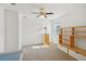 Bright bedroom features a ceiling fan, a large window, and unique built-in shelving unit at 8932 Sw 101St Cir, Ocala, FL 34481