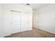 Clean bedroom with large closet and white doors and neutral colored walls at 8932 Sw 101St Cir, Ocala, FL 34481