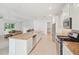 Well-equipped kitchen with stainless steel appliances, ample counter space, an island and seamless flow to living spaces at 8932 Sw 101St Cir, Ocala, FL 34481