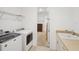 Laundry room area features a sink, and modern machines at 8932 Sw 101St Cir, Ocala, FL 34481