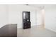 Clean home office with a built-in hutch on tile flooring with neutral-colored walls at 8932 Sw 101St Cir, Ocala, FL 34481