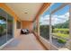 Screened patio with tan flooring and view of backyard at 8932 Sw 101St Cir, Ocala, FL 34481