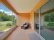 Comfortable screened patio with view of manicured lawn at 8932 Sw 101St Cir, Ocala, FL 34481