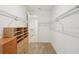 Spacious walk-in closet with wood shelving at 8932 Sw 101St Cir, Ocala, FL 34481