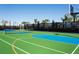 This community has both a basketball and tennis court with palm trees and black fencing at 8944 Sydney Ave, Kissimmee, FL 34747