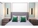 Bedroom features recessed art lighting, chic gray bedding, and matching nightstands at 8944 Sydney Ave, Kissimmee, FL 34747