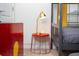 Detail of a red accent table with a lamp near a bunk bed at 8944 Sydney Ave, Kissimmee, FL 34747