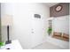 Charming entryway with a built-in bench, decorative pillows, and a welcoming atmosphere at 8944 Sydney Ave, Kissimmee, FL 34747