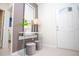 Elegant foyer with a modern console table, stylish stools, and a view of the bedroom at 8944 Sydney Ave, Kissimmee, FL 34747