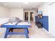 Upstairs game room with air hockey table, TV, and seating at 8944 Sydney Ave, Kissimmee, FL 34747