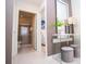 Hallway view with a bathroom and bedroom visible. Features console table and elegant decor at 8944 Sydney Ave, Kissimmee, FL 34747