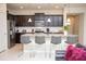 Stylish kitchen with granite countertops, stainless steel appliances, and bar stool seating at the island at 8944 Sydney Ave, Kissimmee, FL 34747