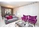 Stylish living area featuring modern furniture, purple accents and open concept design at 8944 Sydney Ave, Kissimmee, FL 34747