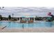 Resort-style pool offers a splash park, covered lounging areas, and pristine surroundings at 8944 Sydney Ave, Kissimmee, FL 34747
