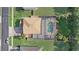 Overhead view displaying fenced-in backyard and pool, complemented by a well-manicured lawn and landscaping at 10231 Lenox St, Clermont, FL 34711