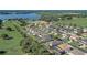 Aerial view of the neighborhood showcasing well-maintained homes, green spaces, and a peaceful, tree-lined street at 10231 Lenox St, Clermont, FL 34711