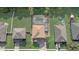 Birds-eye view of this nicely situated home, fully screened-in pool, and meticulously maintained landscaping at 10231 Lenox St, Clermont, FL 34711