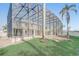 Large, fenced backyard offering plenty of space with beautiful landscaping and a screened-in area at 10231 Lenox St, Clermont, FL 34711