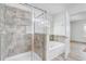 Bathroom with a shower, tiled accent wall, and a garden tub adjacent to a bedroom at 10231 Lenox St, Clermont, FL 34711