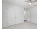 Bright bedroom includes a ceiling fan, closet and door leading to the rest of the house at 10231 Lenox St, Clermont, FL 34711