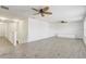 Spacious bonus room with wood-look floors, ceiling fans, and lots of natural light at 10231 Lenox St, Clermont, FL 34711