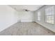 Spacious bonus room with wood-look floors, natural light, and a built-in media center at 10231 Lenox St, Clermont, FL 34711