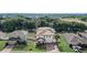 Beautiful two-story home features manicured landscaping, brick driveway, and a covered patio on a large lot at 10231 Lenox St, Clermont, FL 34711