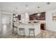 Open kitchen featuring stainless steel appliances, granite countertops and bar stool seating at 10231 Lenox St, Clermont, FL 34711