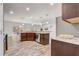 Spacious kitchen featuring granite countertops, wooden cabinets, stainless appliances, and an open layout at 10231 Lenox St, Clermont, FL 34711