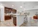Charming kitchen with granite countertops, stainless appliances, and a breakfast bar overlooking living area at 10231 Lenox St, Clermont, FL 34711