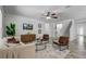 Cozy living room with modern furnishings, a ceiling fan, and hardwood floors that add warmth and style at 10231 Lenox St, Clermont, FL 34711