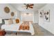 Spacious bedroom with calming decor, a ceiling fan, and large windows offering plenty of natural light at 10231 Lenox St, Clermont, FL 34711