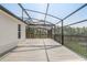 Expansive screened patio offers the perfect outdoor living space for relaxation and entertaining at 10231 Lenox St, Clermont, FL 34711