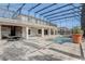 Expansive screened-in patio featuring a swimming pool and outdoor entertaining area at 10231 Lenox St, Clermont, FL 34711