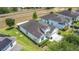 An aerial view of the home showcasing its well-kept landscaping, ample parking, and convenient location at 1061 Suffragatte Cir, Haines City, FL 33844