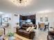 Cozy open concept living area integrates a kitchen, dining space, and living room for seamless entertaining at 1061 Suffragatte Cir, Haines City, FL 33844