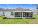 Enjoy the outdoors in this cozy screened patio with neutral decor and comfortable seating at 1061 Suffragatte Cir, Haines City, FL 33844