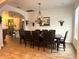 Open dining area featuring tile flooring and views into the kitchen and living room at 1062 Rock Creek St, Apopka, FL 32712