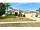 Well-maintained single Gathering home with manicured landscaping and a three car garage at 1062 Rock Creek St, Apopka, FL 32712